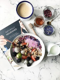 COCONUT CHIA PUDDING WITH BERRIES AND GRANOLA.