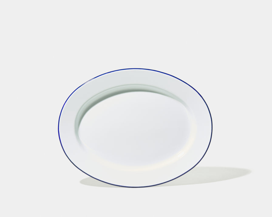 White plate with outlet blue rim